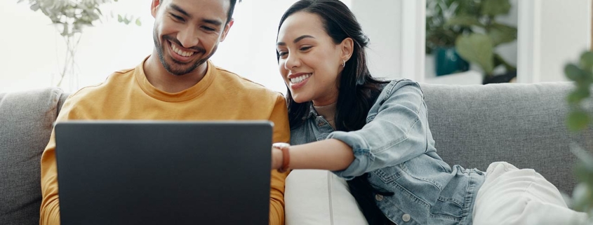 Home laptop, smile and relax couple search internet