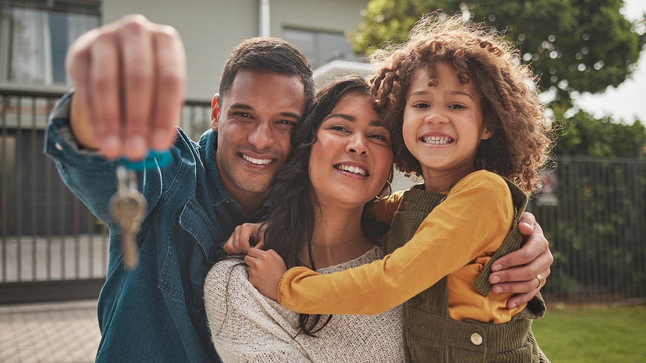 Happy family, portrait and real estate with keys in property, investment or new home together