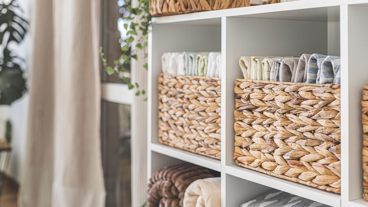 Domestic textile bed linen neatly placed cupboard shelves minimalism Nordic storage method closet organization