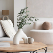 Chair with pillow, coffee table, vase in a living room stock photo