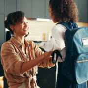 Mom, girl and happy with school uniform in home getting ready for a school day stock photo