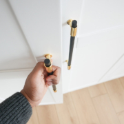Hand opening bedroom cabinet door stock photo
