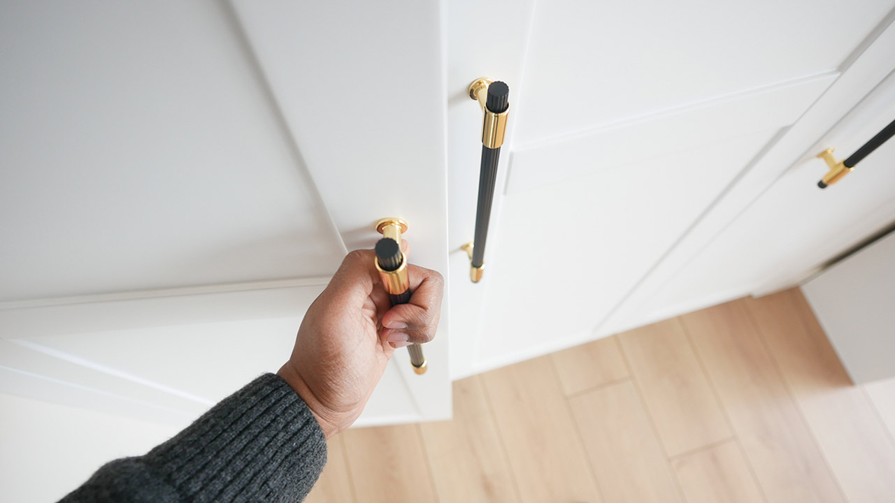 Hand opening bedroom cabinet door stock photo
