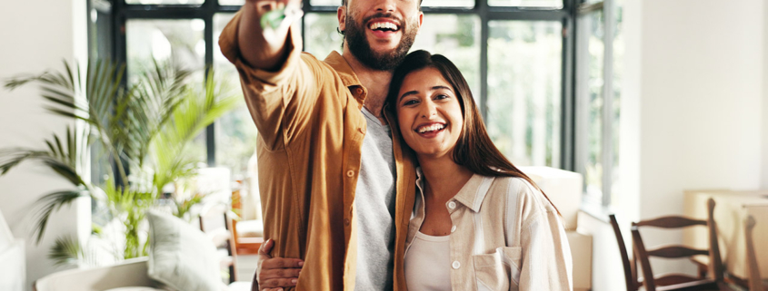 happy home buyers in new home stock photo